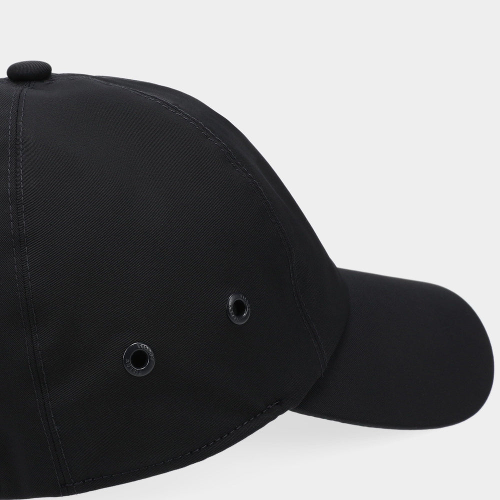 Tilley cap navy with matching accessories for a cohesive travel outfit.