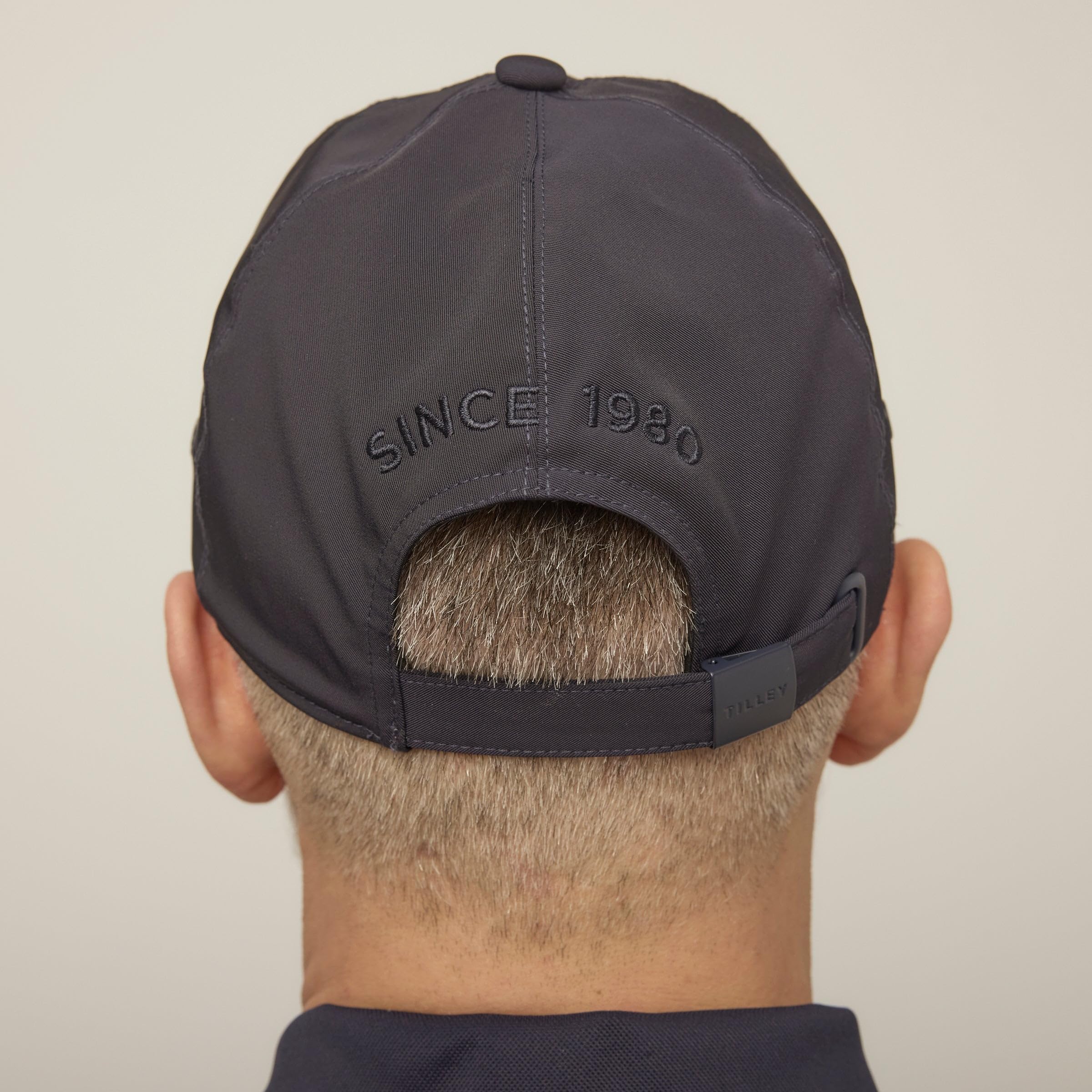Closeup of Tilley cap navy material showing premium bi-stretch twill.
