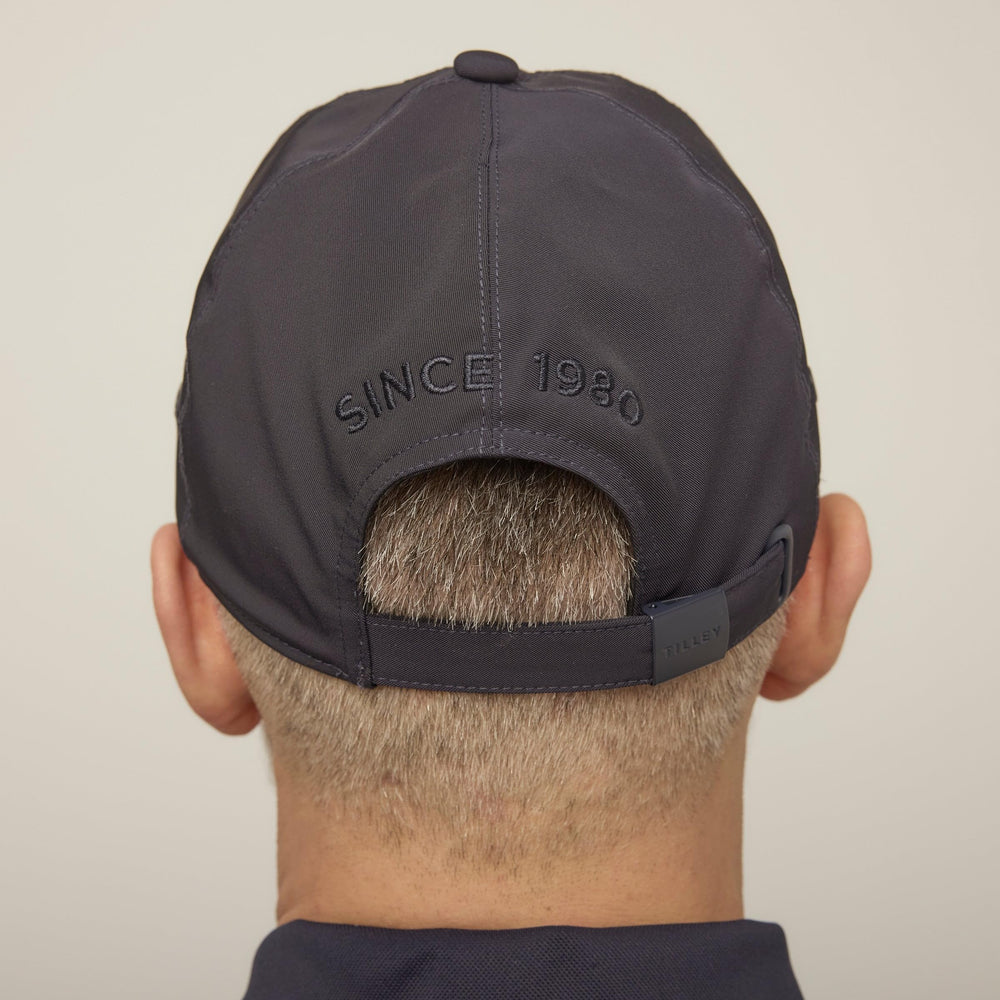 Closeup of Tilley cap navy material showing premium bi-stretch twill.