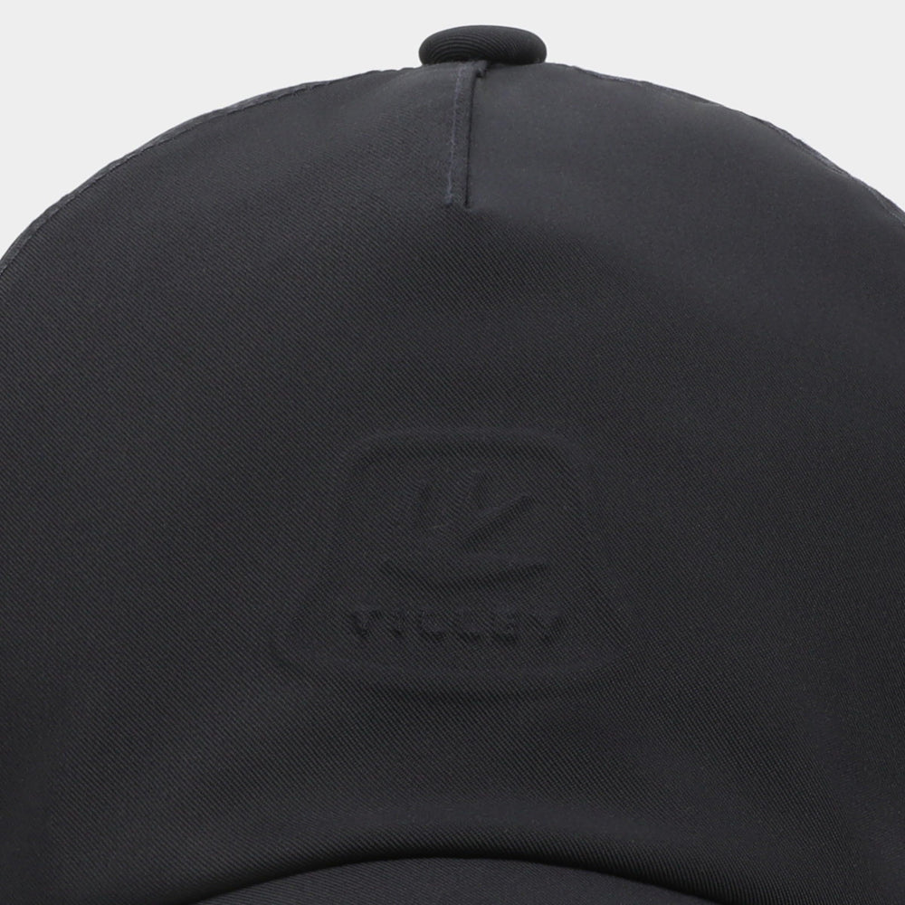 Tilley travel cap navy in use during outdoor activity with ventilation.