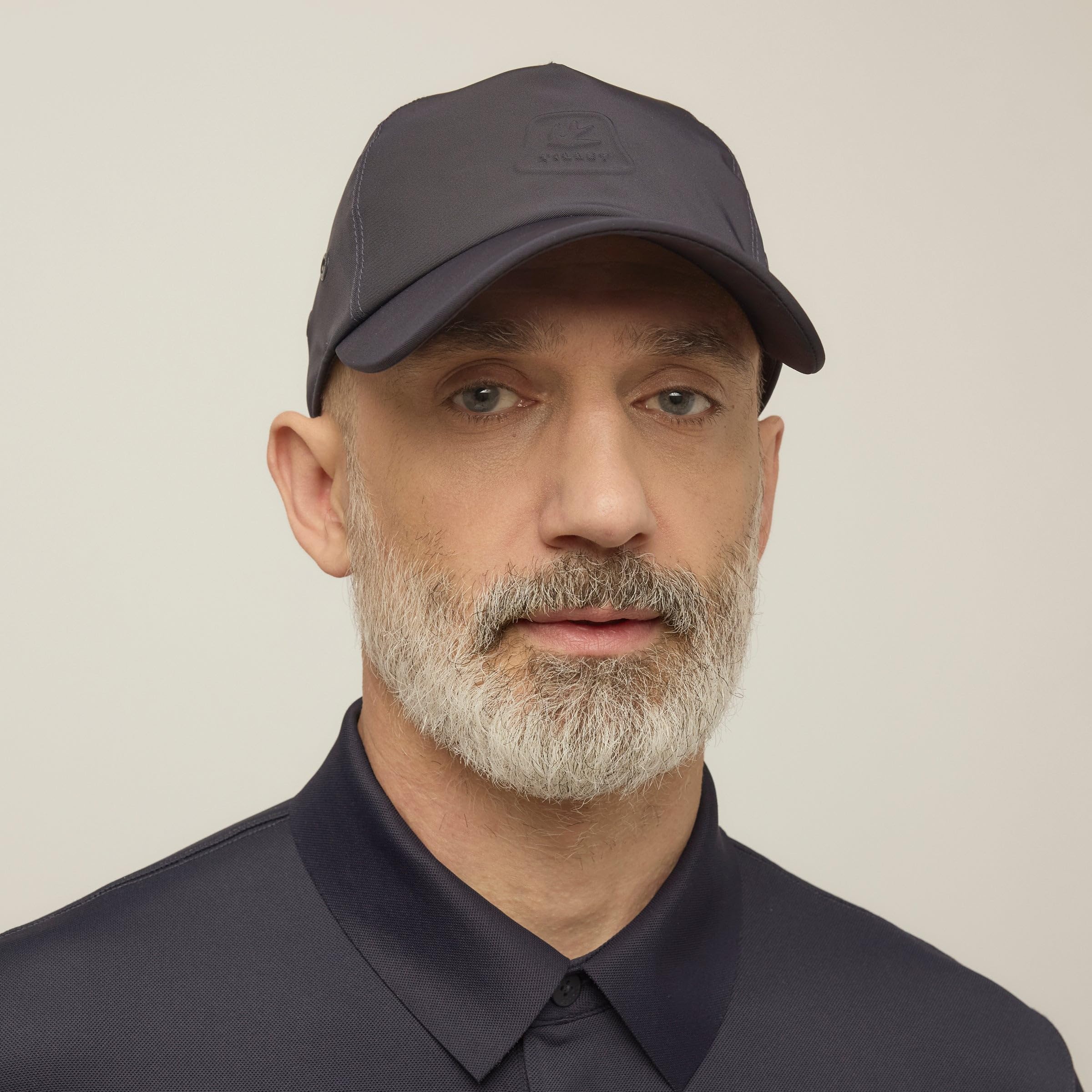 Tilley cap Navy side view highlighting breathable twill and secure fit.
