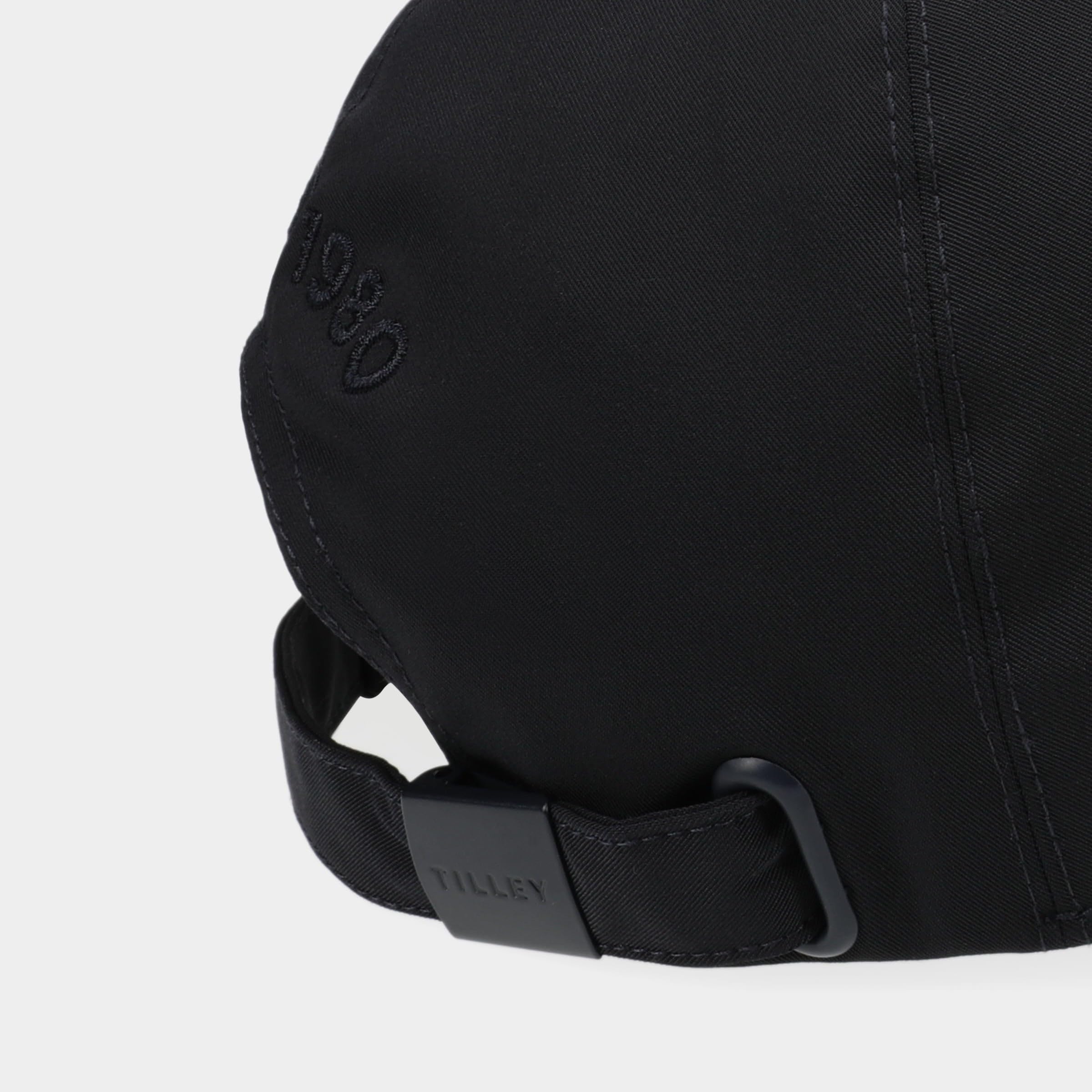Grommet ventilation detail on Tilley Standard New Tech Travel Cap navy.