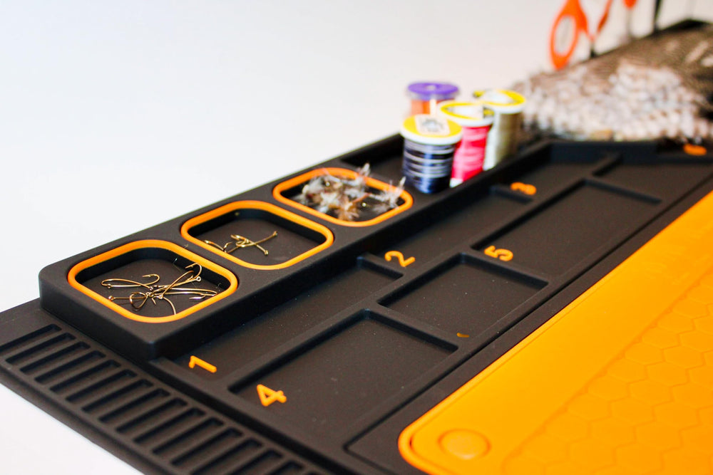 Tinfish Tackle Co storage holes neatly hold scissors and bobbins.