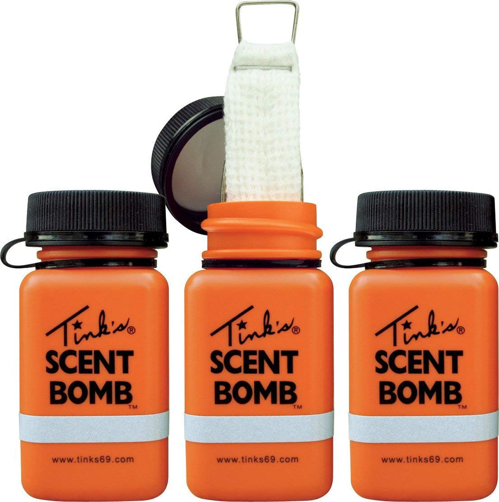 Tink's Scent Bomb dispenser lid with retaining strap for secure transport.
