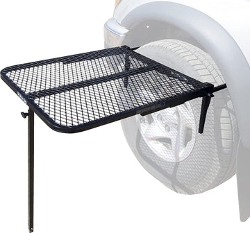 Tire Table attached to a vehicle tire creates a stable outdoor surface.