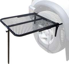 Tire Table attached to a vehicle tire creates a stable outdoor surface.