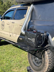 Tire Table small aluminum camping table mounted on tire for stable outdoor prep.