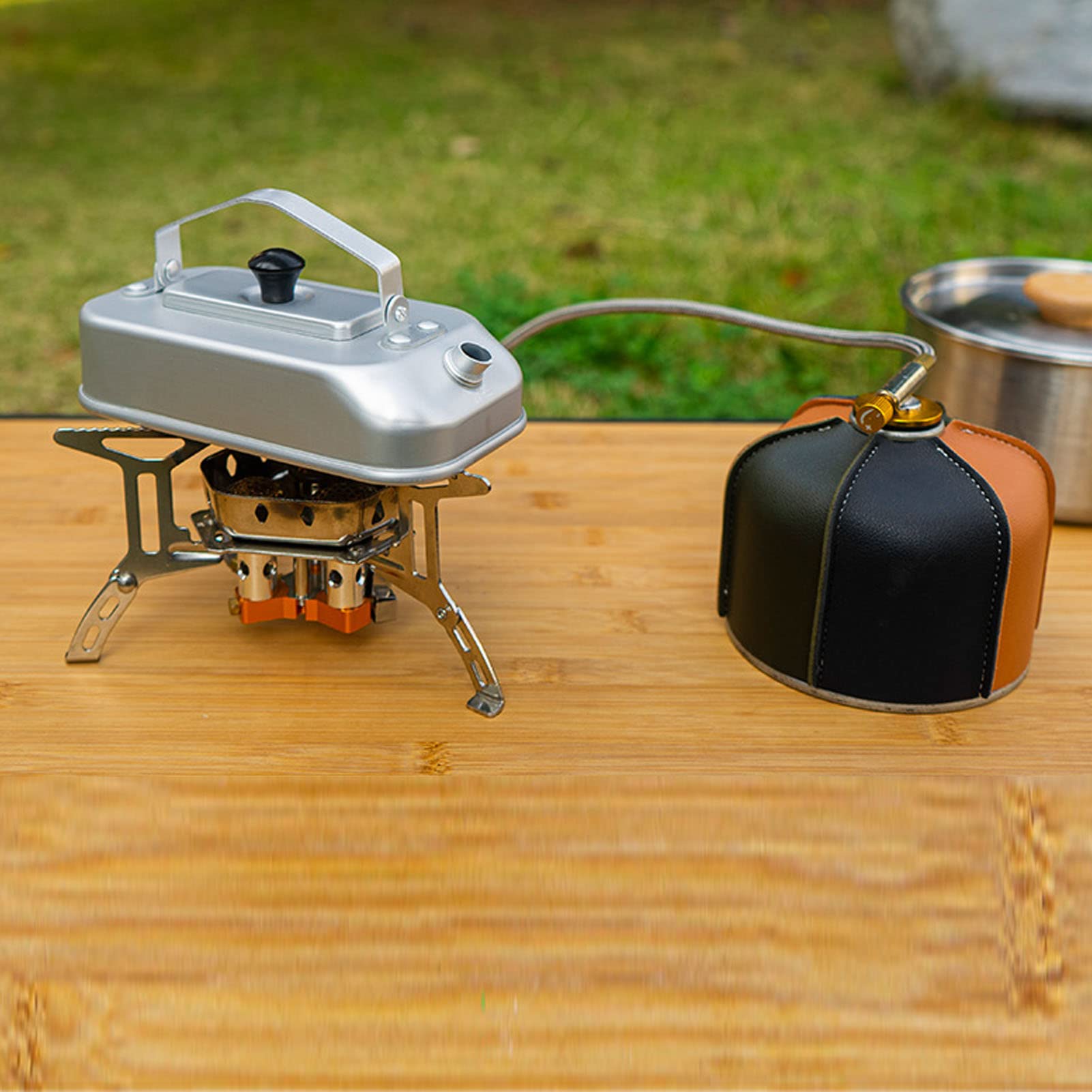 Aluminum camping kettle ready on a camp stove for quick hot drinks