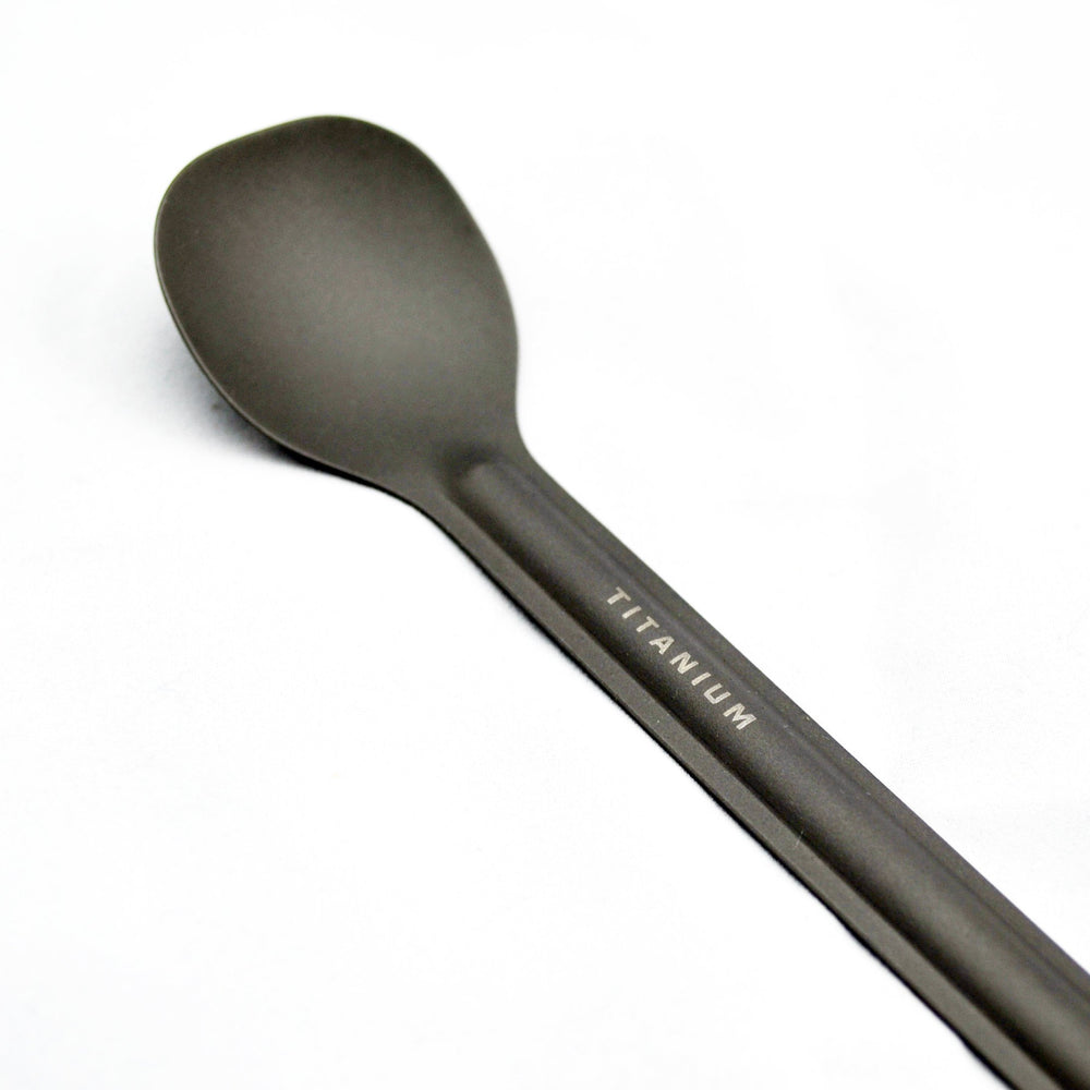 TOAKS reach-the-corner bottle spoon enabling precise scooping in tight spaces.