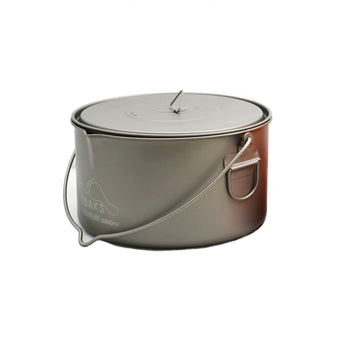 TOAKS Titanium 2000ml pot with bail handle for easy camping transport.