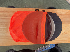 TOAKS Titanium D6.5 plate stacked with frying pan for compact storage.