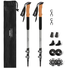TOBTOS telescoping trekking poles extended on rugged trail for stable ascent.
