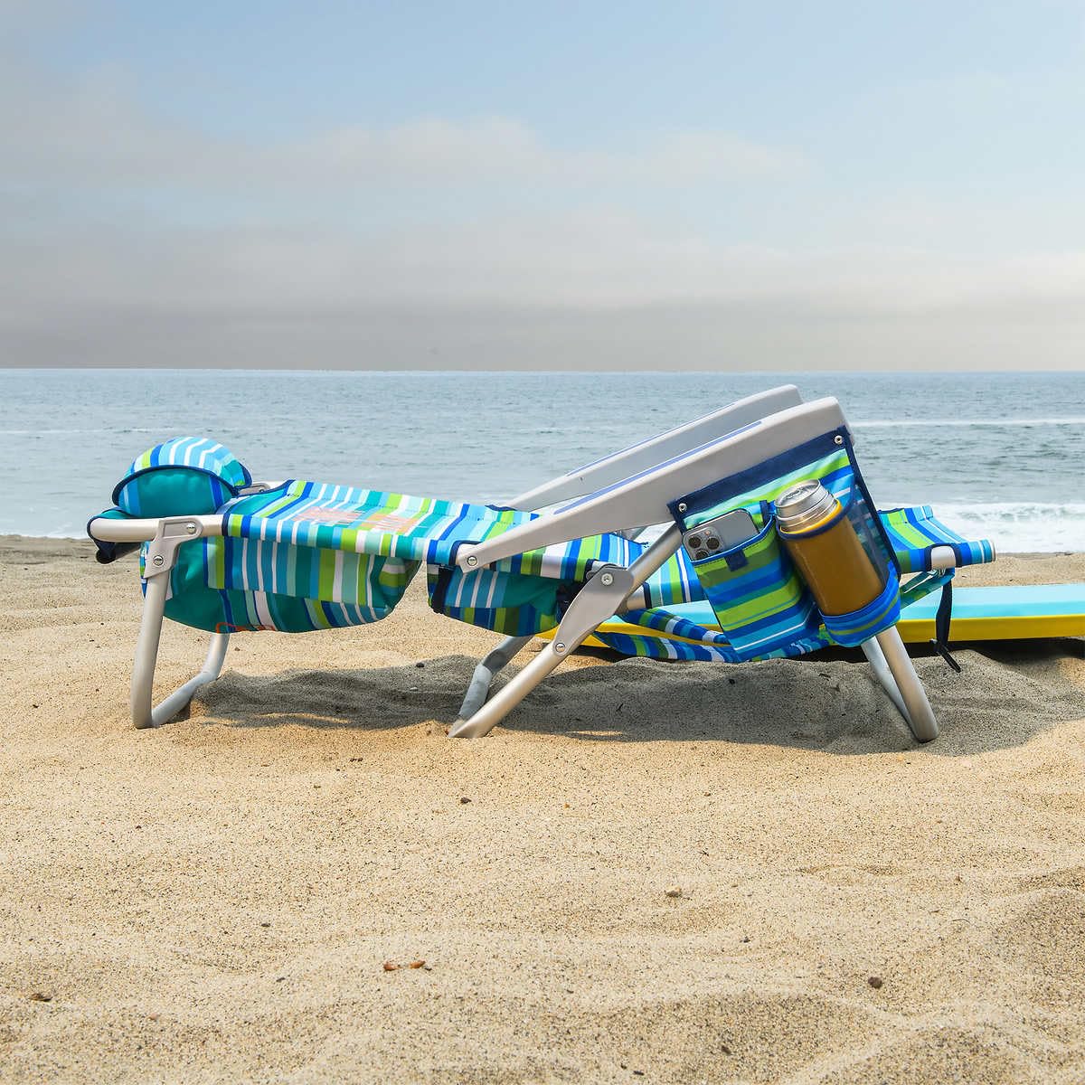 Tommy Bahama 5-Position Beach Chair in green stripes shows adjustable recline positions for personalized comfort.