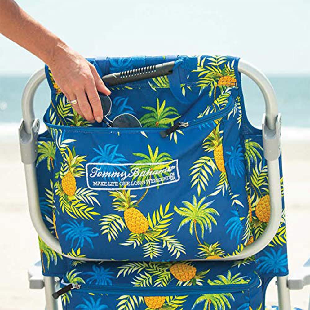 Tommy Bahama beach chair folded with padded backpack straps for transport.