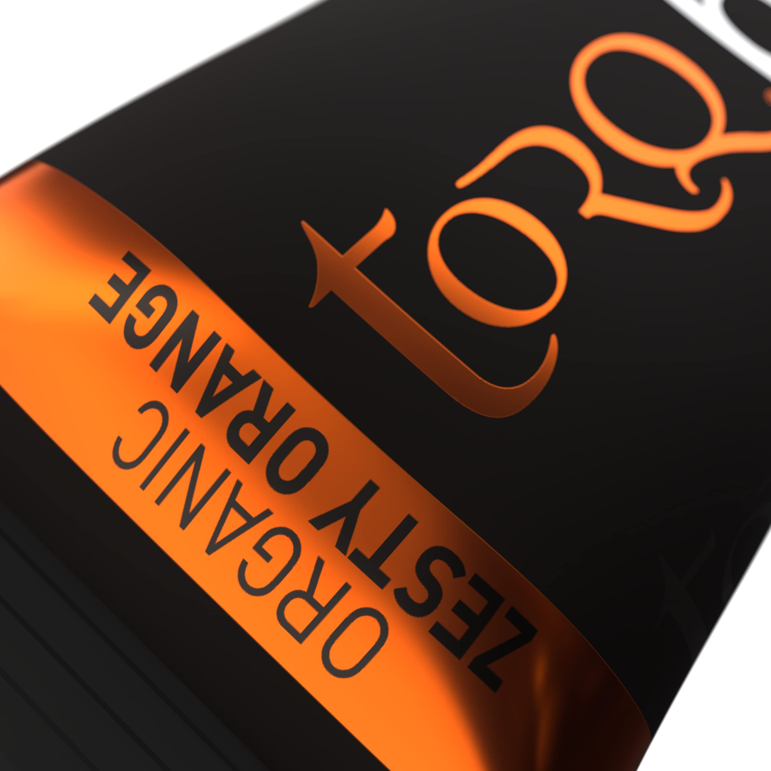 TORQ Zesty Orange energy bar close-up texture showing chewiness