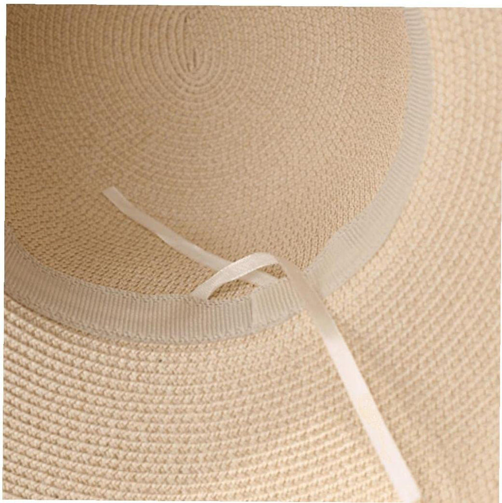 TOSSPER women's straw hat provides sun shade on the beach.