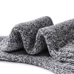 Tough Land Merino Wool Socks in winter setting emphasizing warmth and coziness