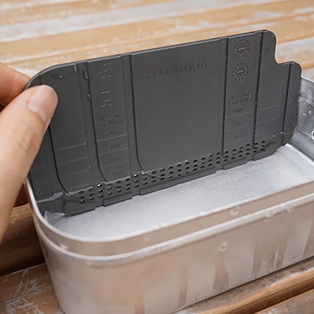 Trangia Multiboard gray compact kitchen setup for on-the-go prep.