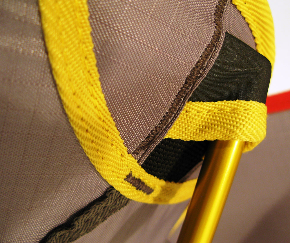 Travel Chair Joey yellow color enhances visibility and outdoor style.