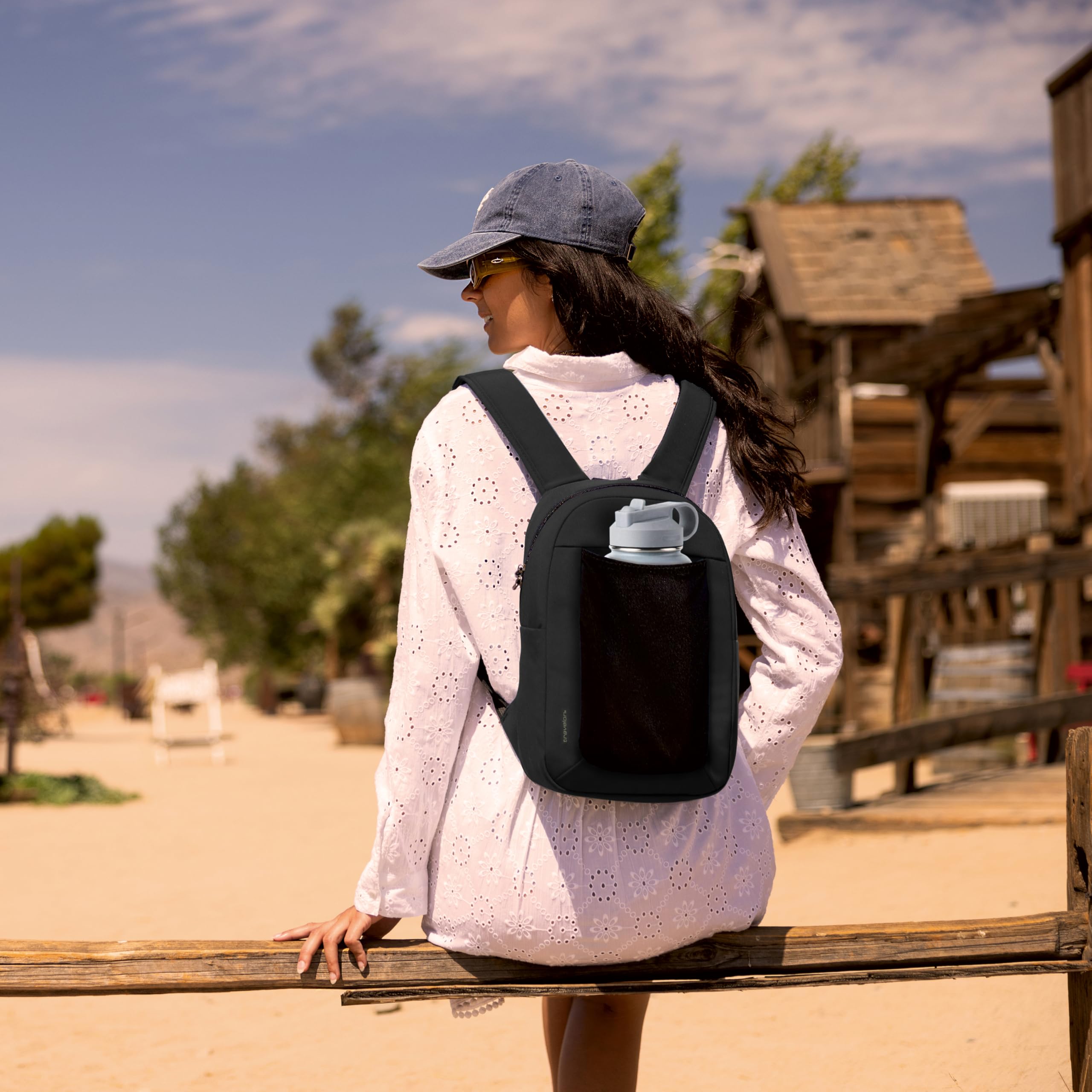 Travelon Voyages small backpack side pocket ready for water bottle.