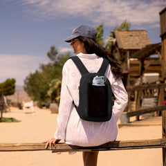 Travelon Voyages small backpack side pocket ready for water bottle.