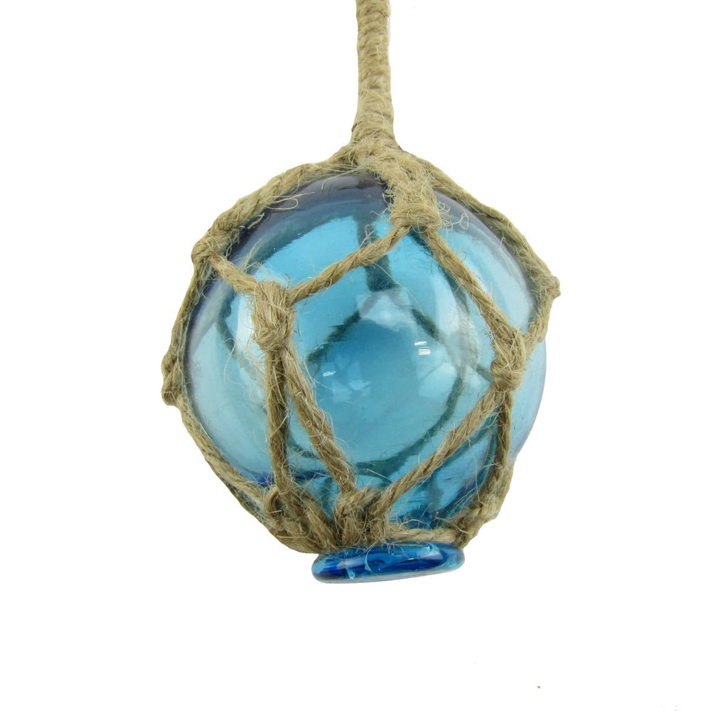 Light blue glass float buoy hanging from a nautical rope