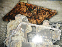 Close-up of hub-style umbrella protecting hunter from rain and sun