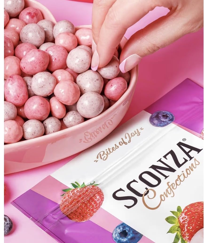 Triple Berry Yogurt Creme bites close-up shows yogurt coating and vibrant berries for a gourmet snack.