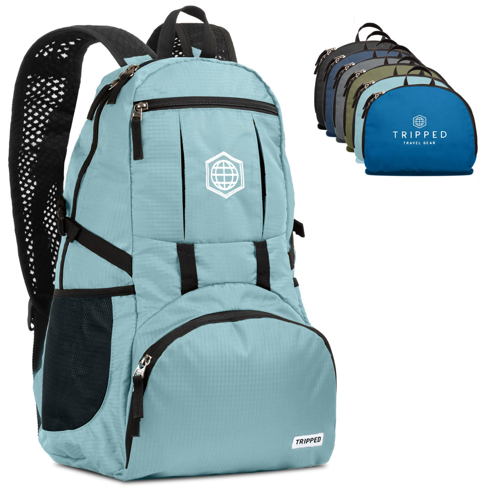 TRIPPED Travel Gear teal foldable backpack front view for compact packing and travel readiness.