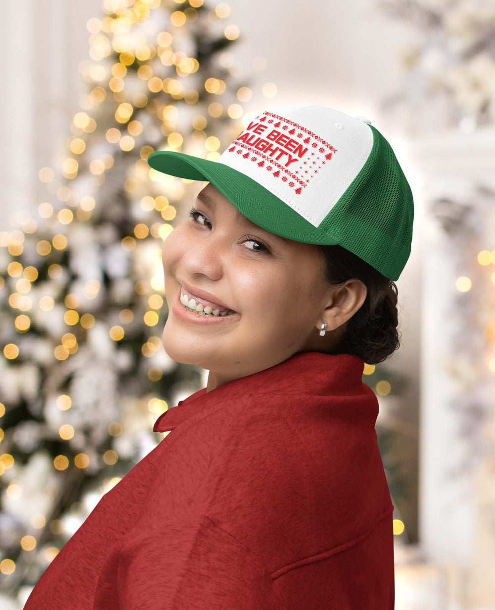 Close-up of Tstars I've Been Naughty cap front print showcasing playful holiday style.