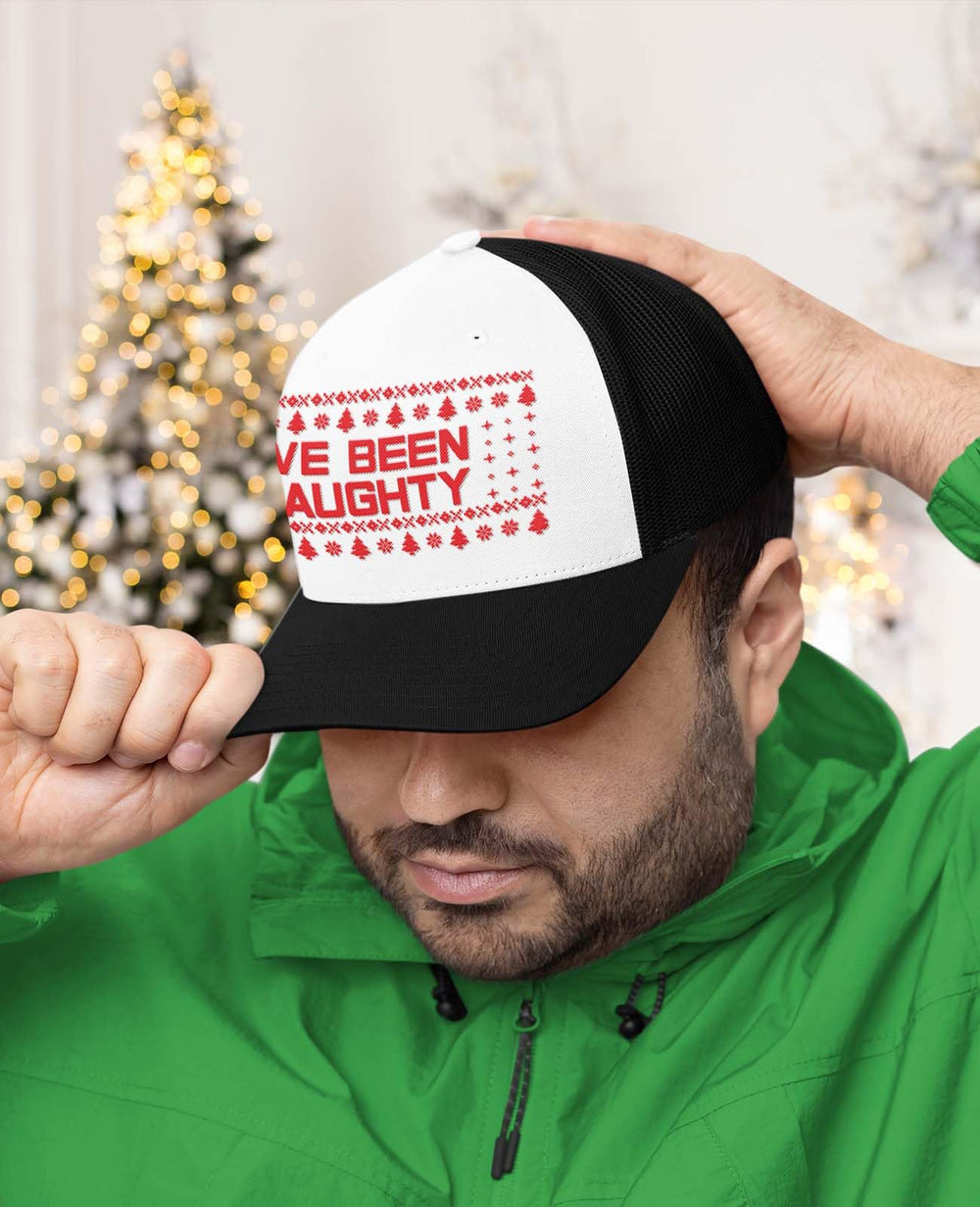 Naughty List Christmas graphic on the five-panel trucker hat