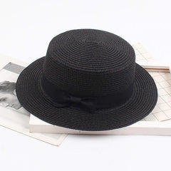 Tuduoms straw boater hat in Panama style flat top for chic vacation looks.