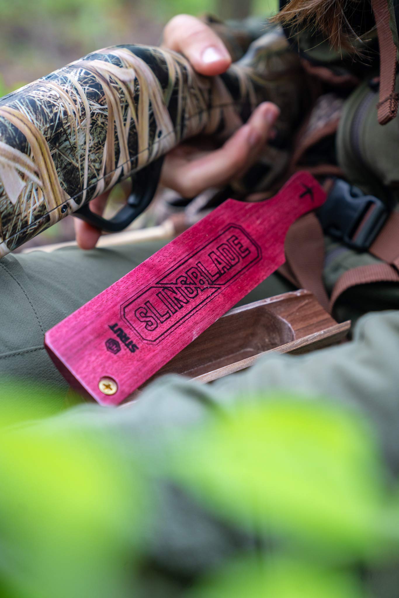 Close view of Slingblade turkey call highlighting clucks and yelps