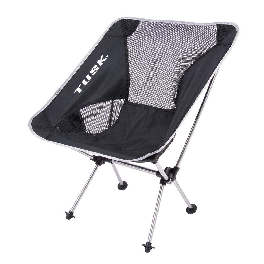 Tusk Compact Camp Chair Medium in use at a campsite