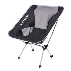 Tusk Compact Camp Chair Medium in use at a campsite