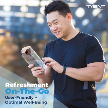 TYENT hydrogen bottle in use with glass demonstrates refreshing on-demand hydration.