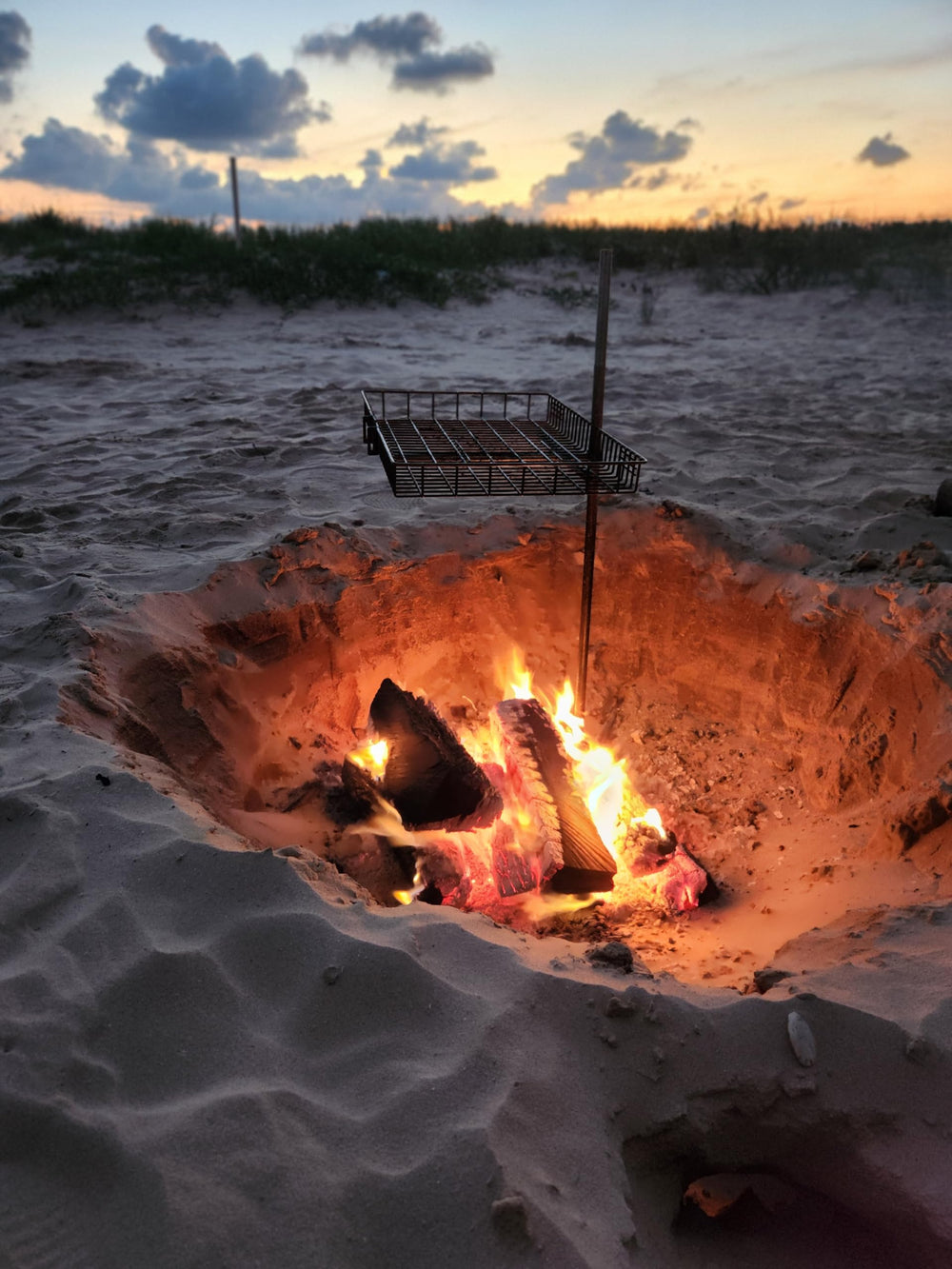 Tyrux grill on campfire setup during a trail cook