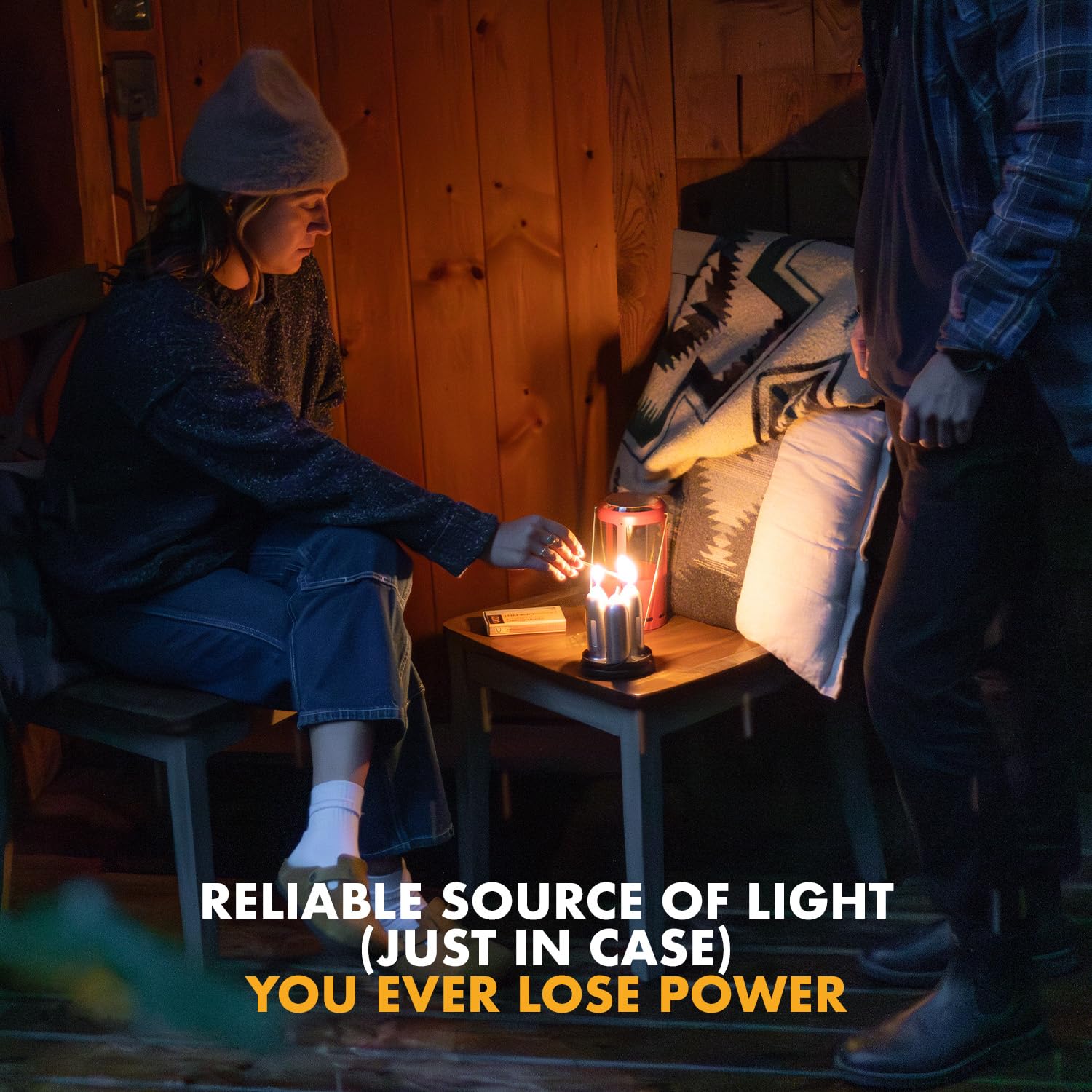 UCO 15-hour white candle in lantern outdoors for ambient camplight.