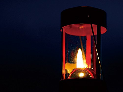 UCO 24351 red lantern, side view, portable light for campsite evenings.