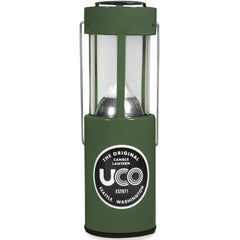 UCO 24352 candle lantern in use providing warm ambient light outdoors.