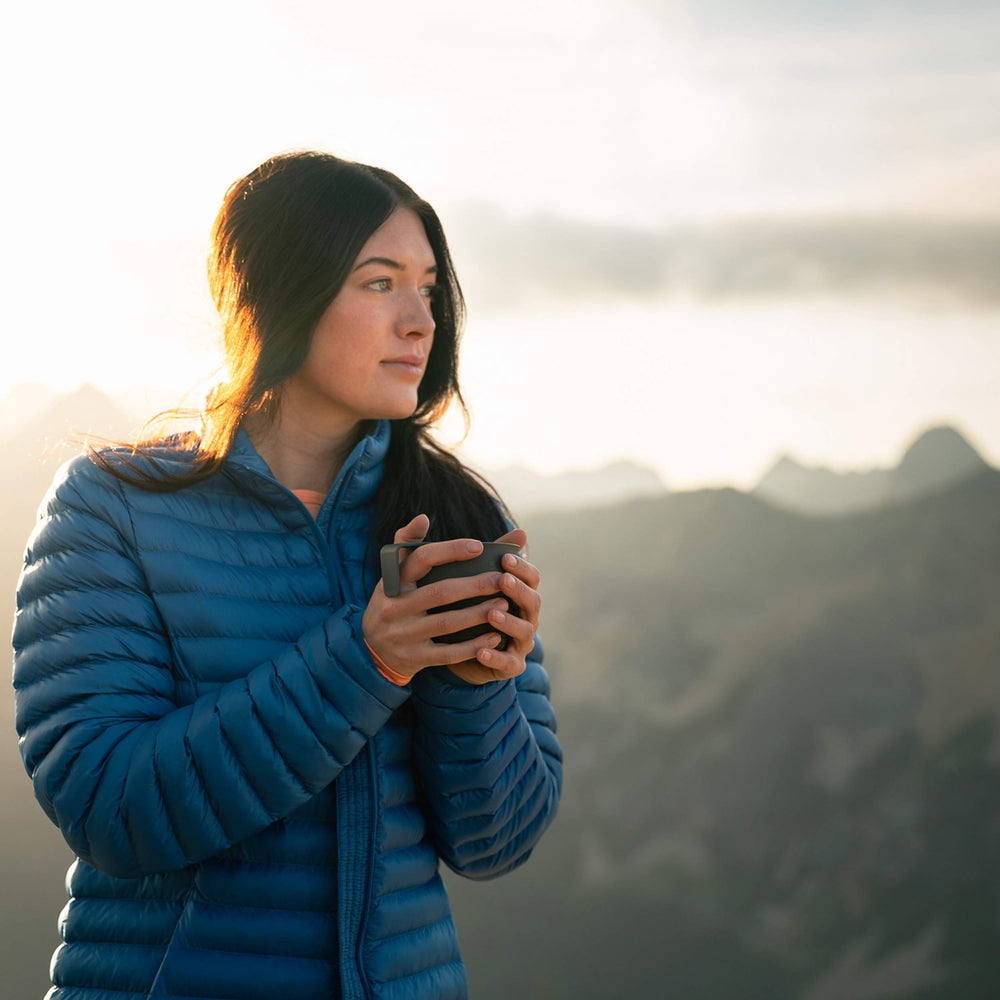 UCO 12-ounce collapsible cup in use for hot beverage outdoors