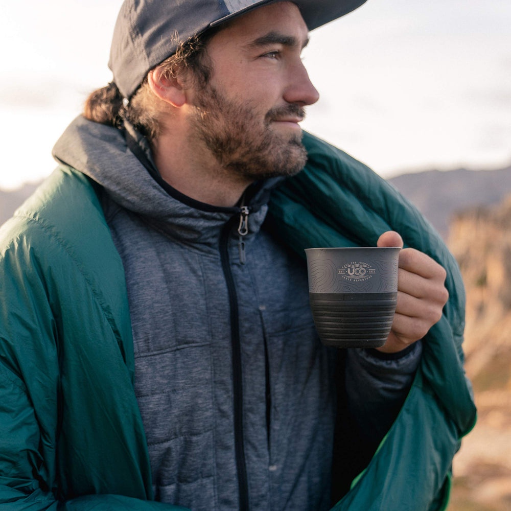 UCO collapsible camp cup with cold beverage during a hike