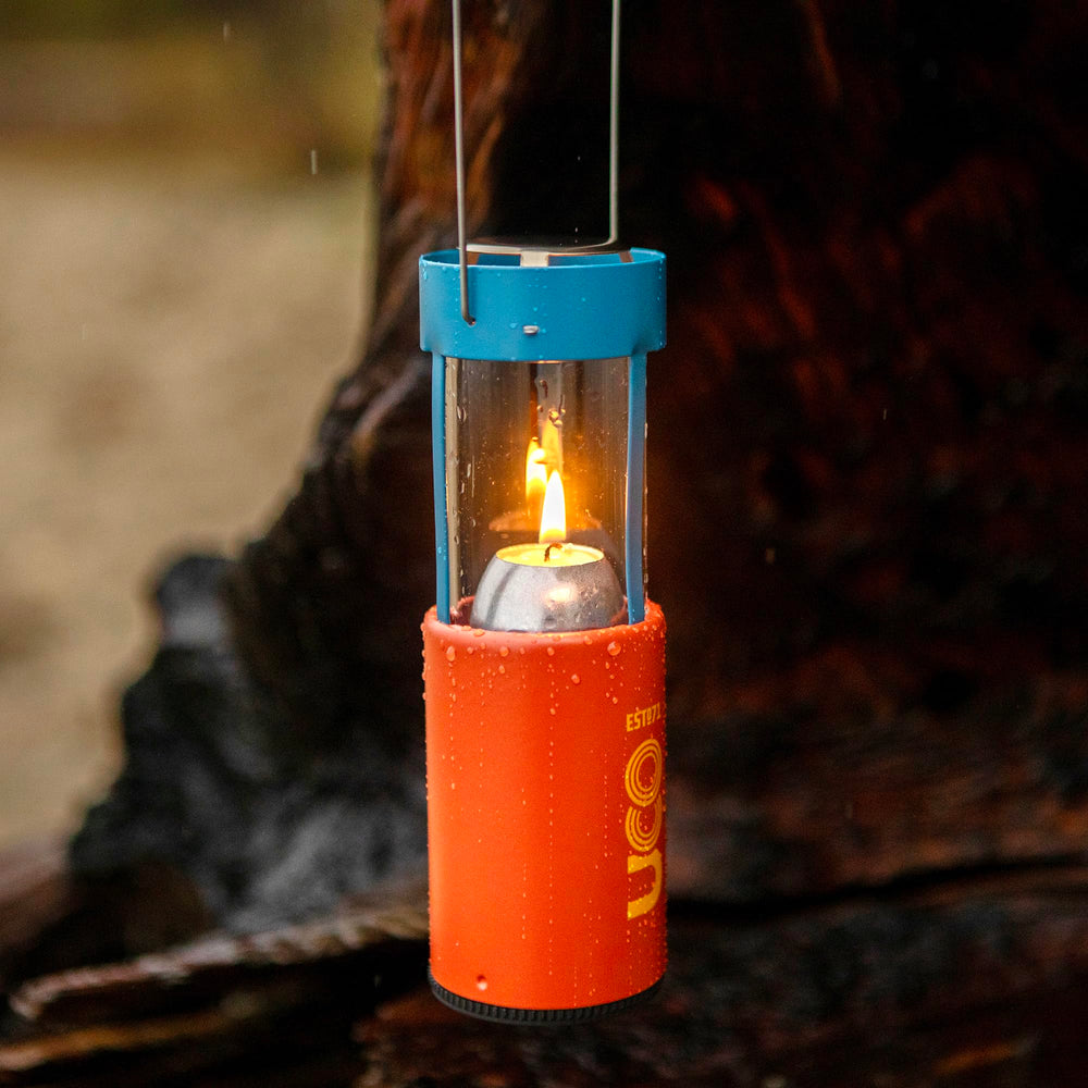 UCO Original Candle Lantern portable with handle and hook for camping setups.