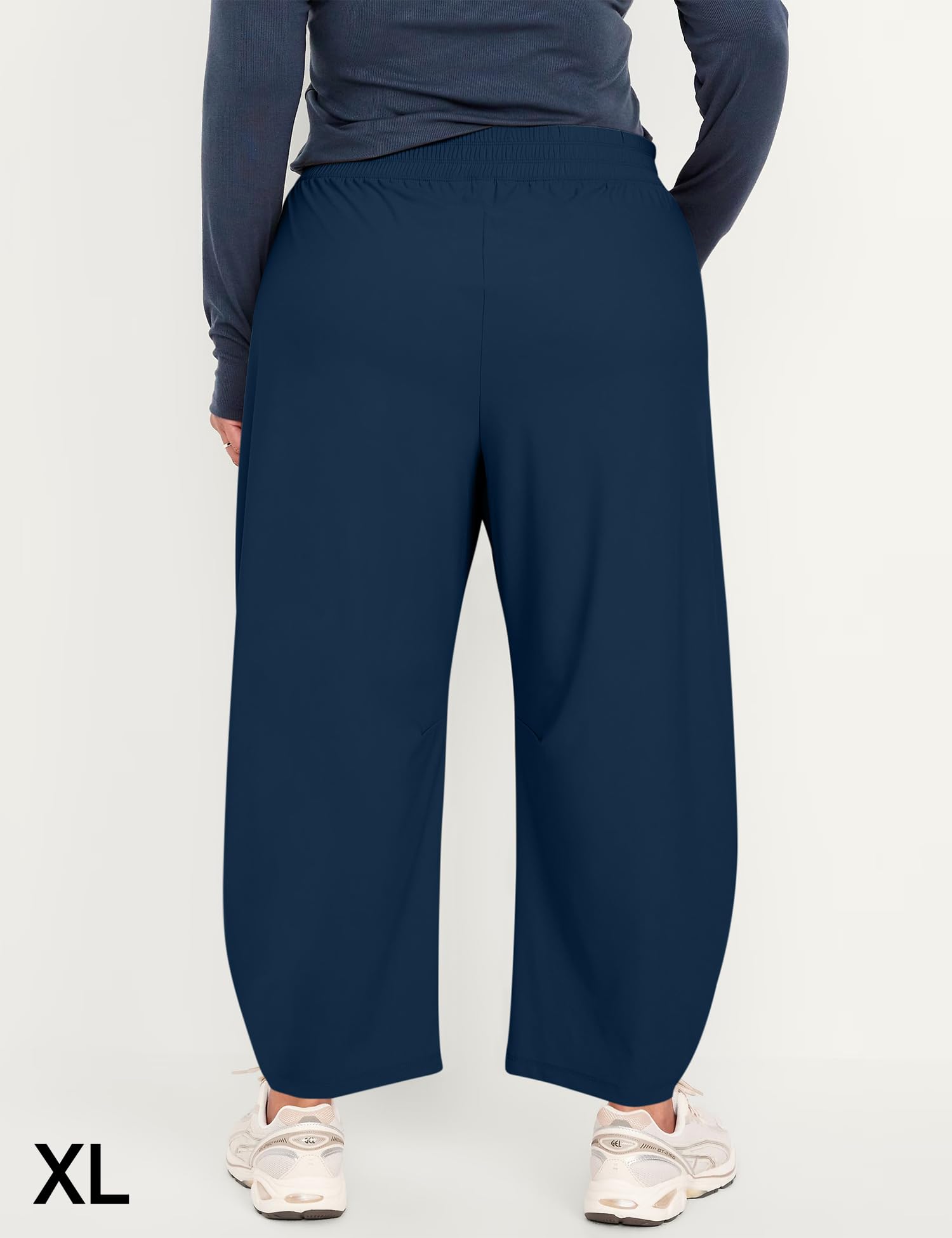 Ugerlov barrel ankle pants blue in-motion hiking shot shows unrestricted mobility.