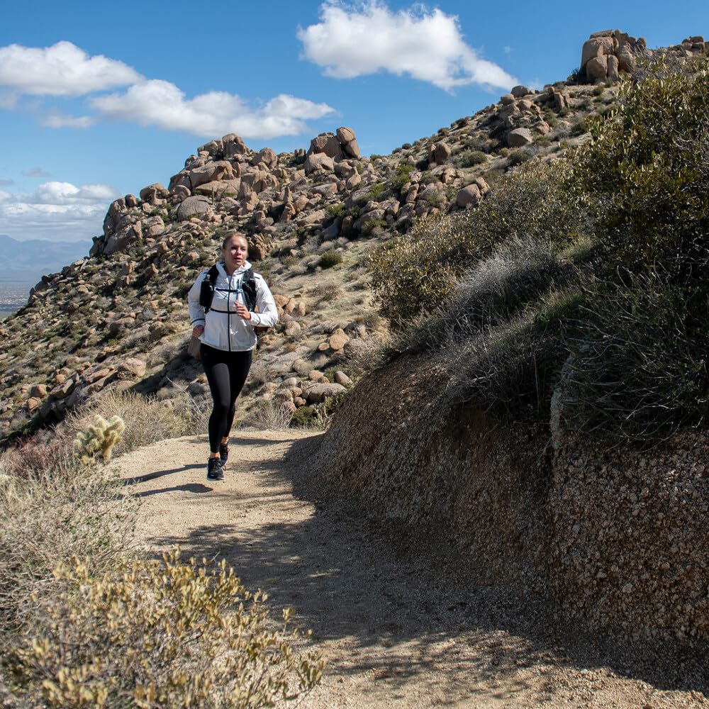 Ultimate Direction Adventure Vesta vest deployable rainfly shields you in wet weather.
