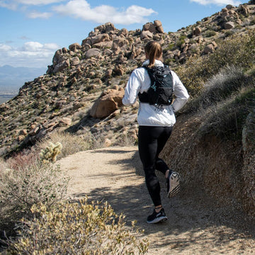 Ultimate Direction Adventure Vesta GPS pocket secures locator device on rugged routes.