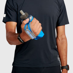 Ultimate Direction Clutch with collapsible soft flask for lightweight, on-the-go hydration.