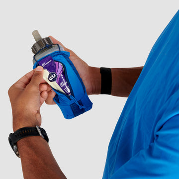 Ultimate Direction Clutch with secure zip pocket for valuables during workouts.