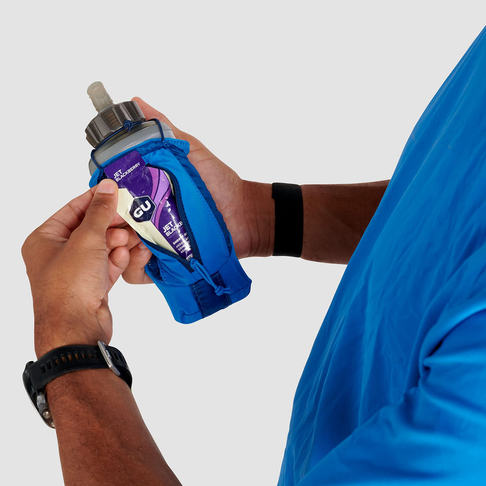 Ultimate Direction Clutch with secure zip pocket for valuables during workouts.