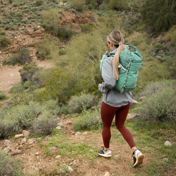 Emerald colorway of the Ultimate Direction FastPackHer 20L backpack.